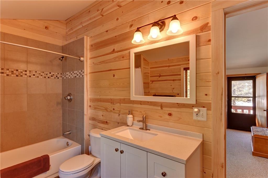 2206 Campfire Road Hartsel, CO 80449 - Photo 21 of 35 a bathroom with a granite countertop sink toilet and shower