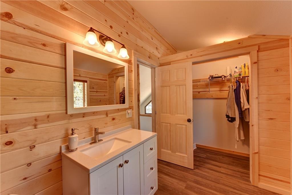 2206 Campfire Road Hartsel, CO 80449 - Photo 22 of 35 a bathroom with a double vanity sink mirror and shower