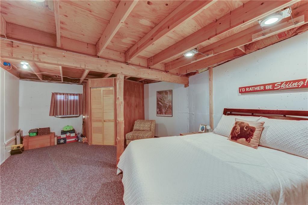 2206 Campfire Road Hartsel, CO 80449 - Photo 26 of 35 a bedroom with a bed and a walk in closet