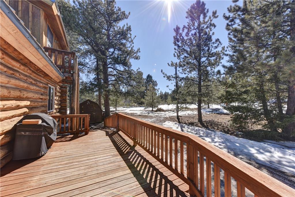 2206 Campfire Road Hartsel, CO 80449 - Photo 30 of 35 a view of balcony with wooden floor and fence