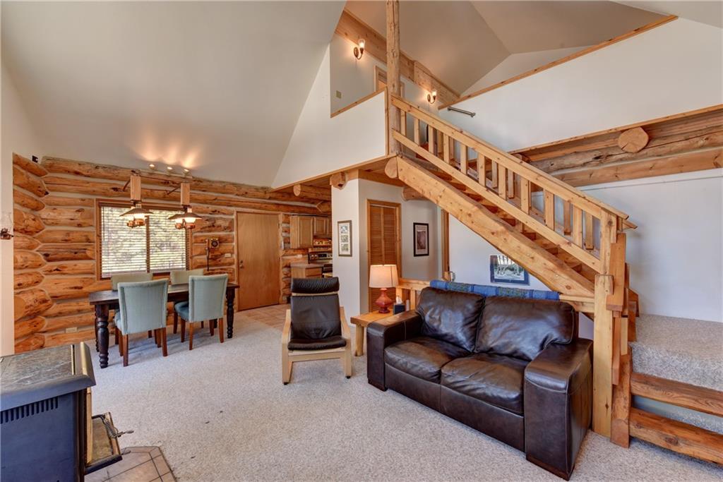 2206 Campfire Road Hartsel, CO 80449 - Photo 8 of 35 a living room with lots of furniture and a chandelier