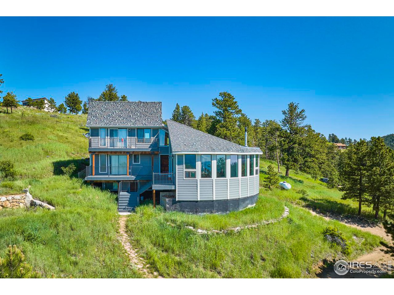 430 Dixon Road Boulder, CO 80302 - Photo 3 of 5 a view of a house with a yard
