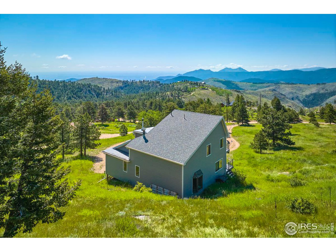 430 Dixon Road Boulder, CO 80302 - Photo 4 of 5 a view of a house with a yard and mountain