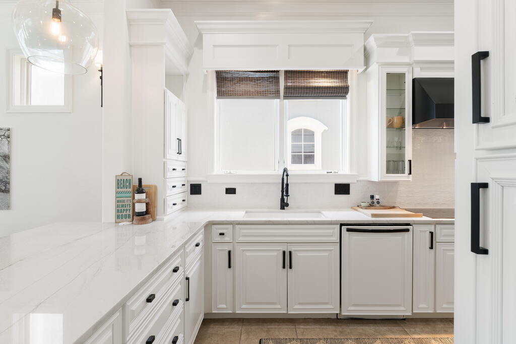 4748 Ocean Boulevard Destin, FL 32541 - Photo 32 of 80 a kitchen with cabinets and window