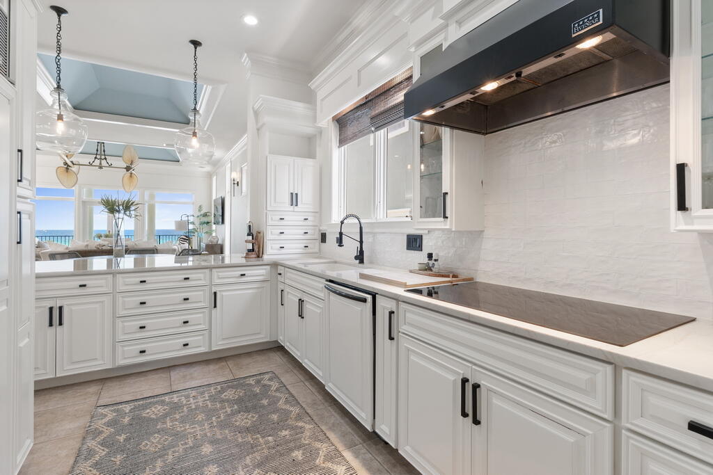 4748 Ocean Boulevard Destin, FL 32541 - Photo 34 of 80 a kitchen with cabinets appliances and a sink