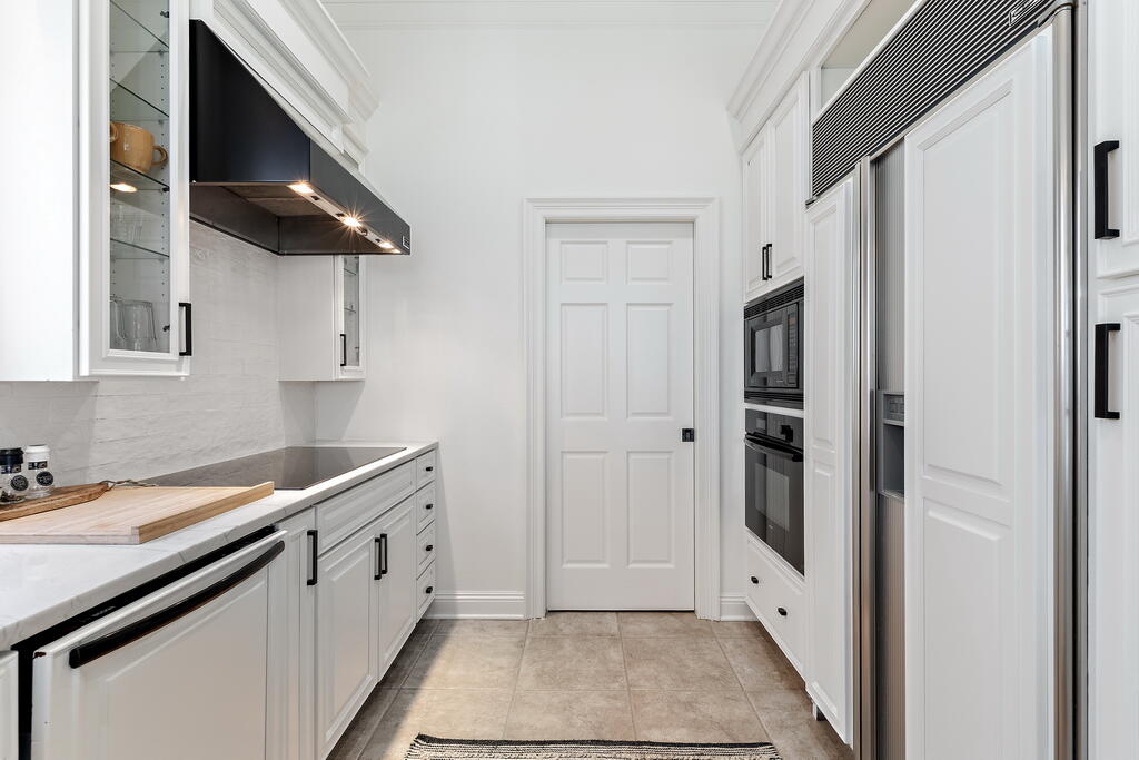 4748 Ocean Boulevard Destin, FL 32541 - Photo 37 of 80 a kitchen with stainless steel appliances granite countertop a refrigerator and a sink