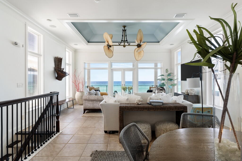 4748 Ocean Boulevard Destin, FL 32541 - Photo 42 of 80 a living room with fireplace furniture and a large window