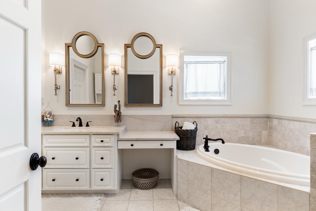 4748 Ocean Boulevard Destin, FL 32541 - Photo 51 of 80 a bathroom with a sink and a mirror