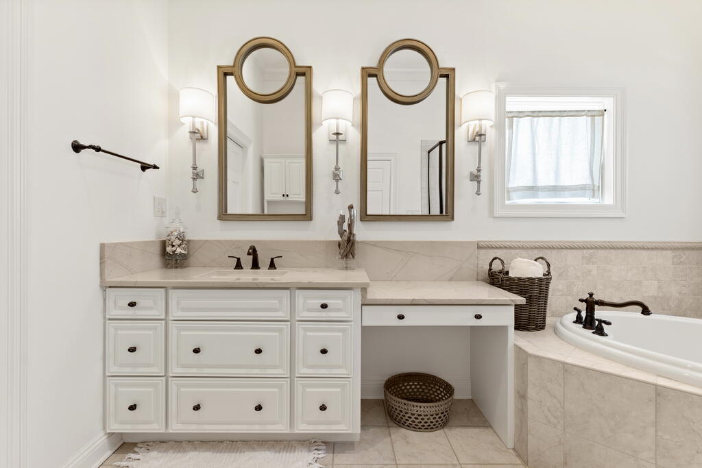 4748 Ocean Boulevard Destin, FL 32541 - Photo 52 of 80 a bathroom with a sink and a mirror