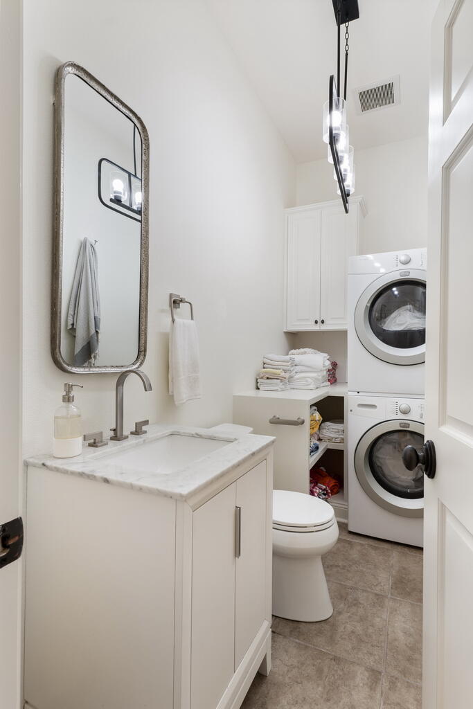 4748 Ocean Boulevard Destin, FL 32541 - Photo 57 of 80 a bathroom with a toilet sink and vanity
