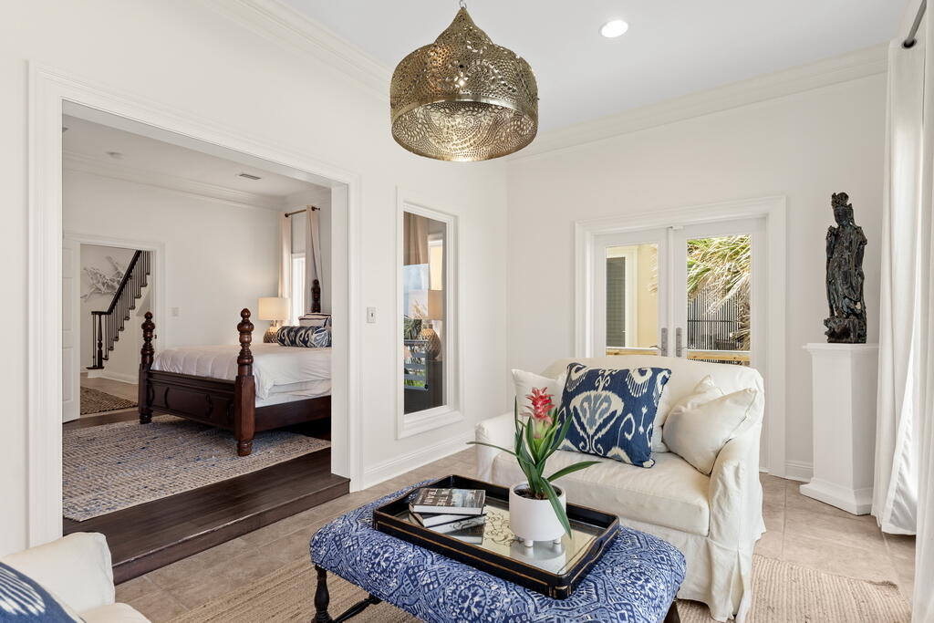 4748 Ocean Boulevard Destin, FL 32541 - Photo 63 of 80 a living room with furniture and a chandelier