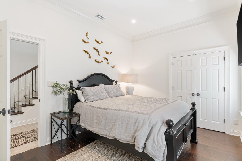 4748 Ocean Boulevard Destin, FL 32541 - Photo 65 of 80 a bedroom with a bed and wooden floor