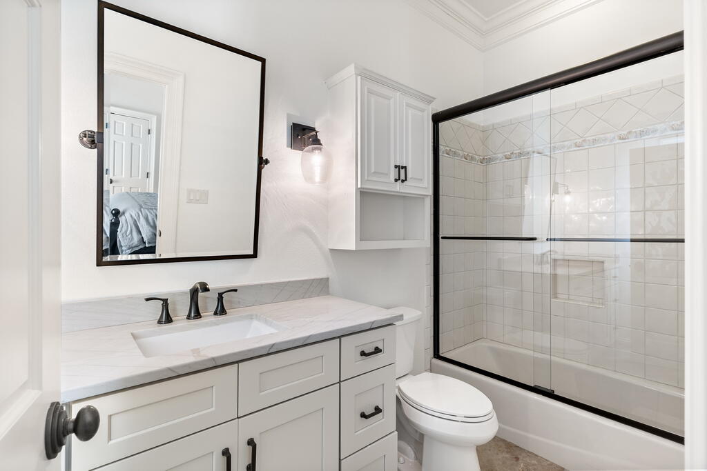 4748 Ocean Boulevard Destin, FL 32541 - Photo 67 of 80 a bathroom with a sink a toilet and shower