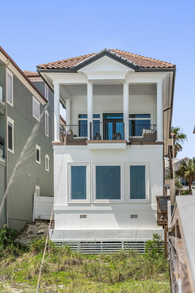 4748 Ocean Boulevard Destin, FL 32541 - Photo 71 of 80 a front view of a house with garden