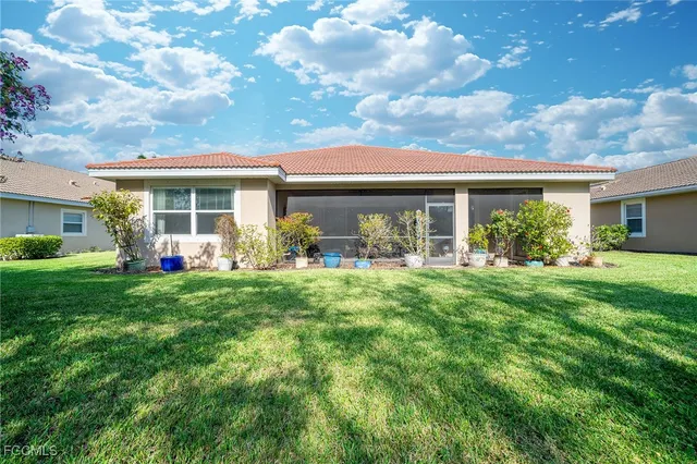 a view of a house with yard and front view of a house