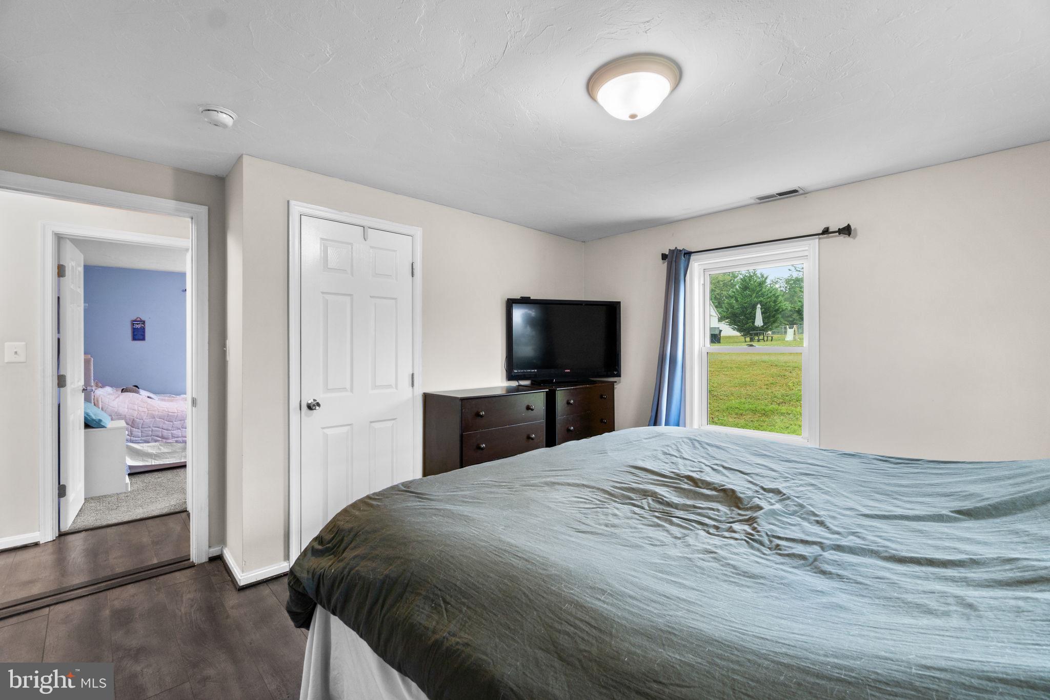 1272 Cherrytown Road Westminster, MD 21158 - Photo 12 of 30 a bedroom with a bed and a flat screen tv