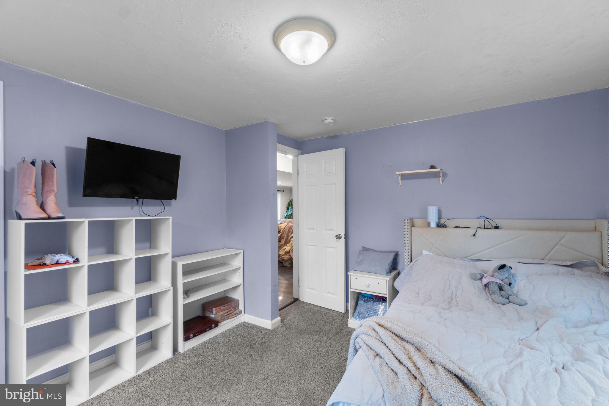 1272 Cherrytown Road Westminster, MD 21158 - Photo 15 of 30 a living room with a flat screen tv and a couch