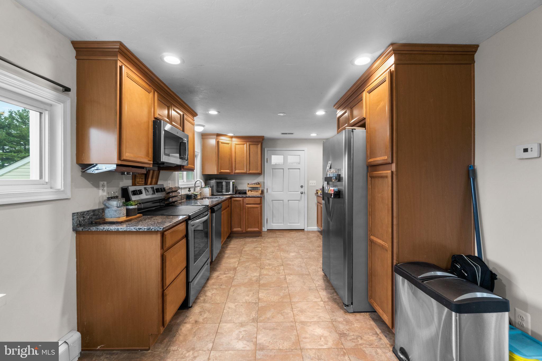 1272 Cherrytown Road Westminster, MD 21158 - Photo 8 of 30 a kitchen with stainless steel appliances granite countertop a refrigerator a stove and a sink