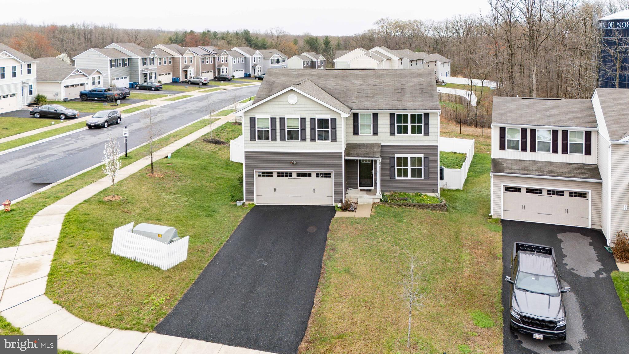 an aerial view of a house with a swimming pool