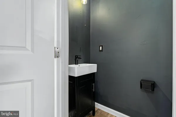 a bathroom with a sink and mirror