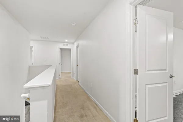 a view of a hallway with entryway