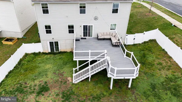 a aerial view of a house with backyard