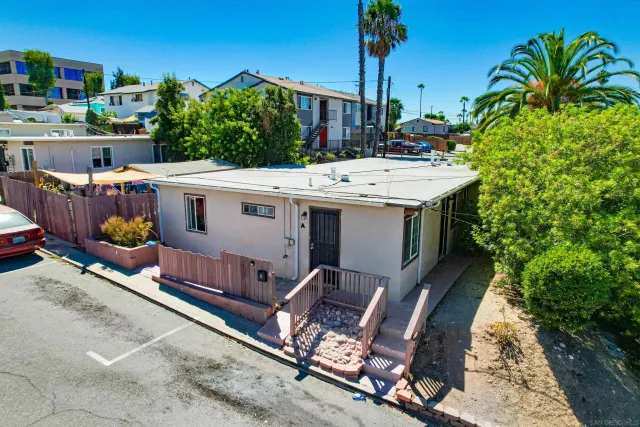 a view of a chairs and table in the patio