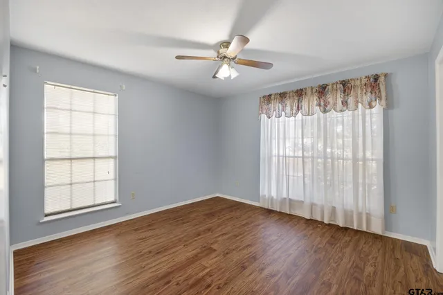 a view of an empty room with a fan