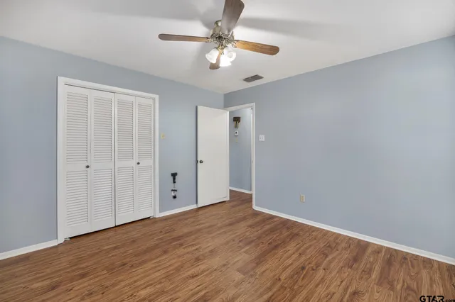 a bathroom with a sink mirror and vanity