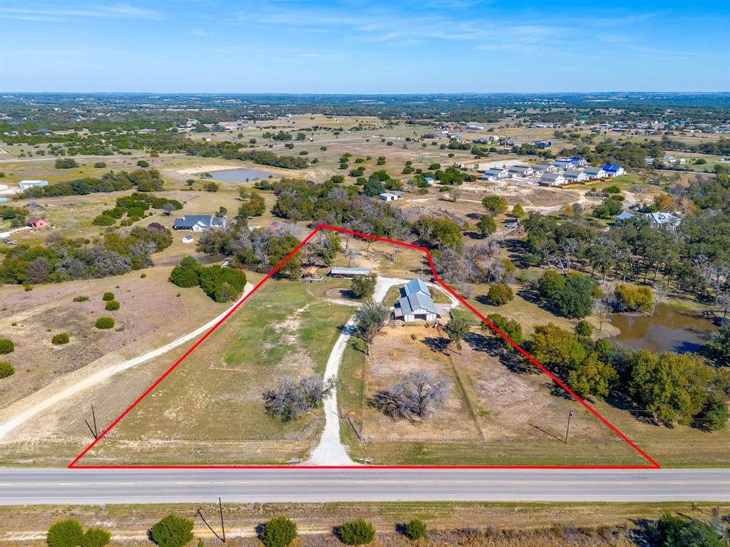4200 Farm To Market 920 Weatherford, TX 76088 - Photo 1 of 40 an aerial view of residential houses with outdoor space