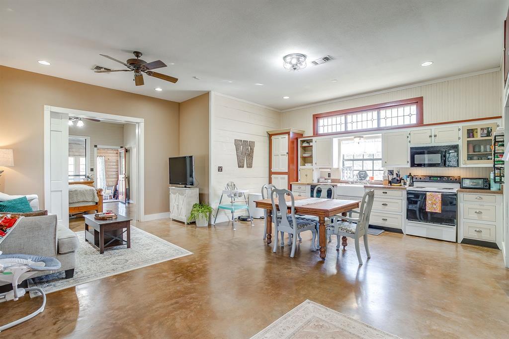 4200 Farm To Market 920 Weatherford, TX 76088 - Photo 11 of 40 a view of a dining room with furniture window and wooden floor