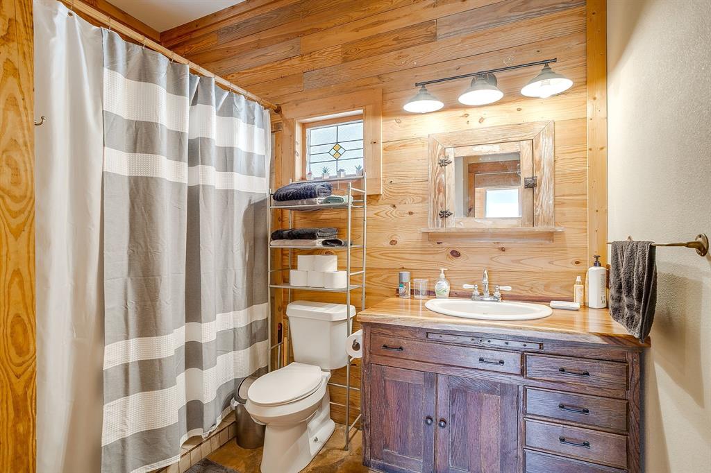 4200 Farm To Market 920 Weatherford, TX 76088 - Photo 19 of 40 a bathroom with a sink toilet and shower