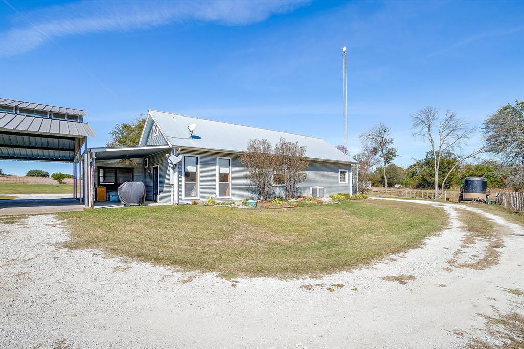 4200 Farm To Market 920 Weatherford, TX 76088 - Photo 22 of 40 a view of a house with a yard and many windows