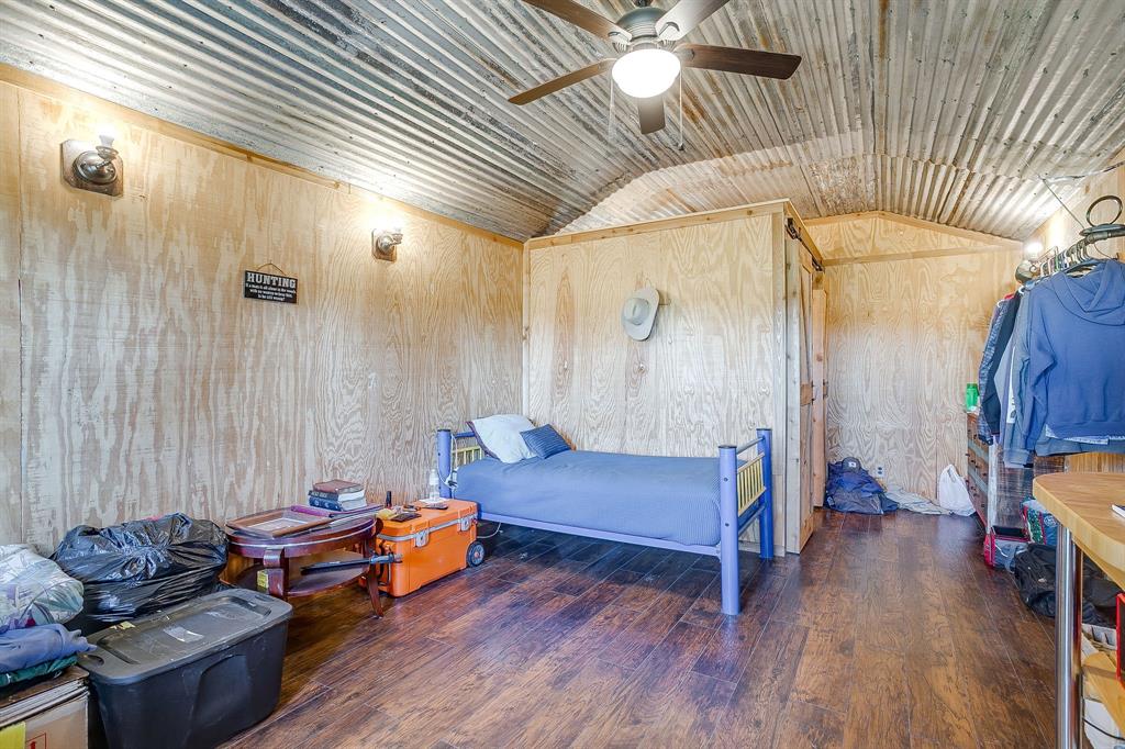 4200 Farm To Market 920 Weatherford, TX 76088 - Photo 32 of 40 a living room with furniture and a wooden floor
