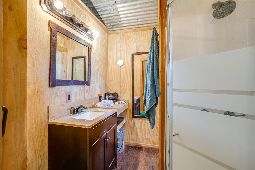 4200 Farm To Market 920 Weatherford, TX 76088 - Photo 33 of 40 a bathroom with a sink and a mirror