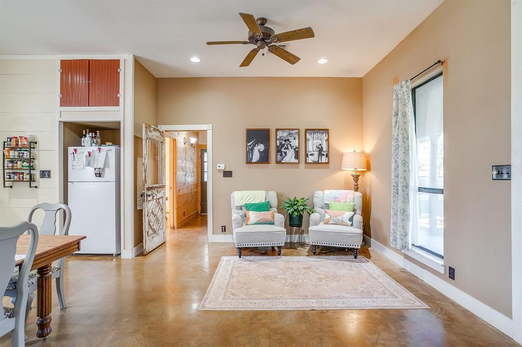 4200 Farm To Market 920 Weatherford, TX 76088 - Photo 7 of 40 a living room with furniture and a chandelier