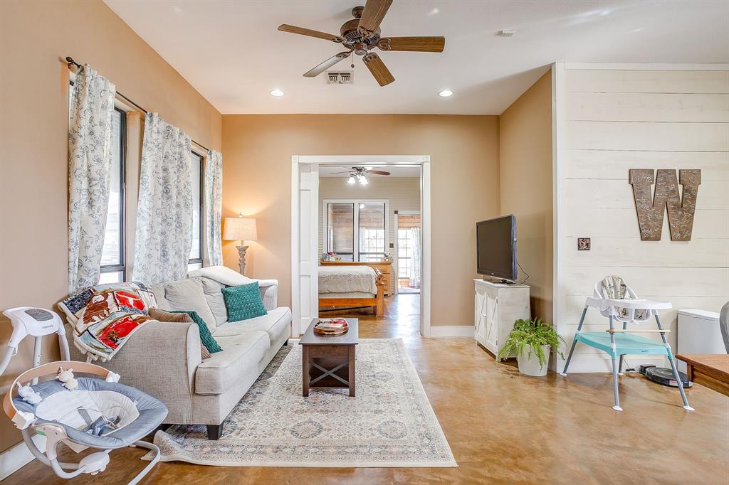 4200 Farm To Market 920 Weatherford, TX 76088 - Photo 8 of 40 a living room with furniture and a flat screen tv