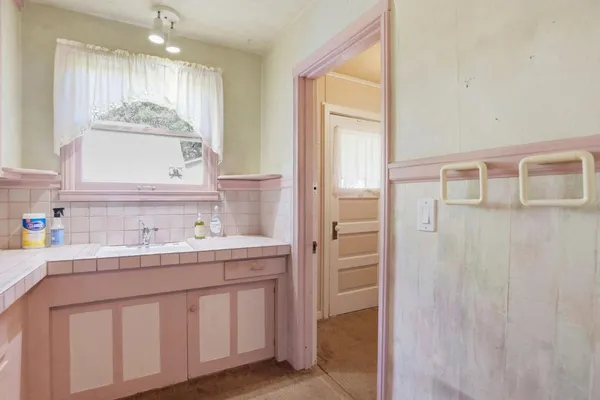 a bathroom with a double vanity sink mirror and