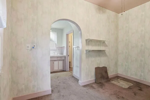 a view of a hallway with a washer and dryer