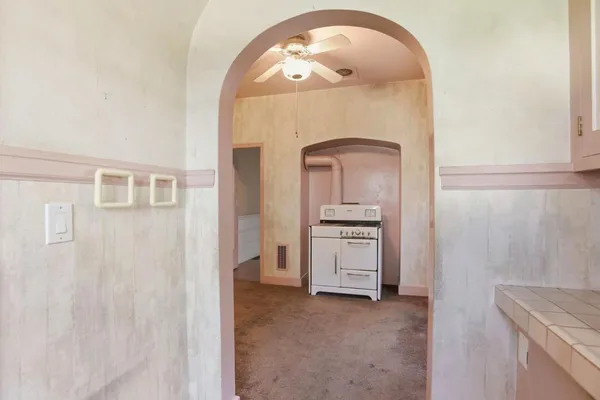 a kitchen with a sink cabinets and window