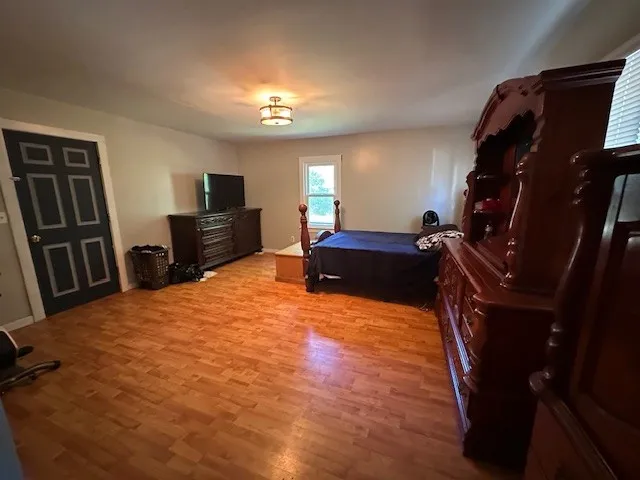 a bed room with a bed and a television