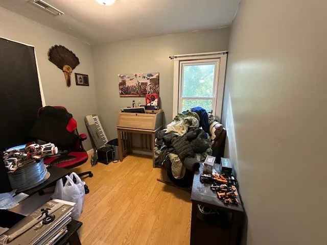 a living room with furniture a rug and a window