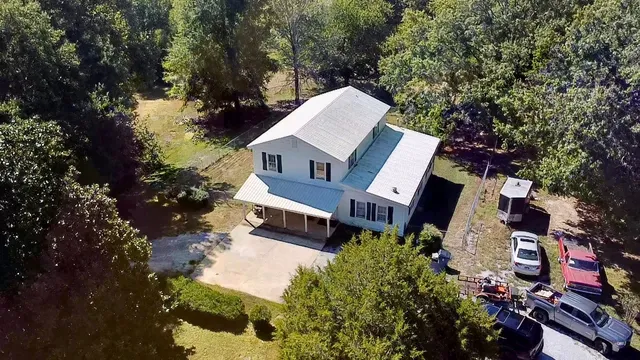 a front view of a house with yard