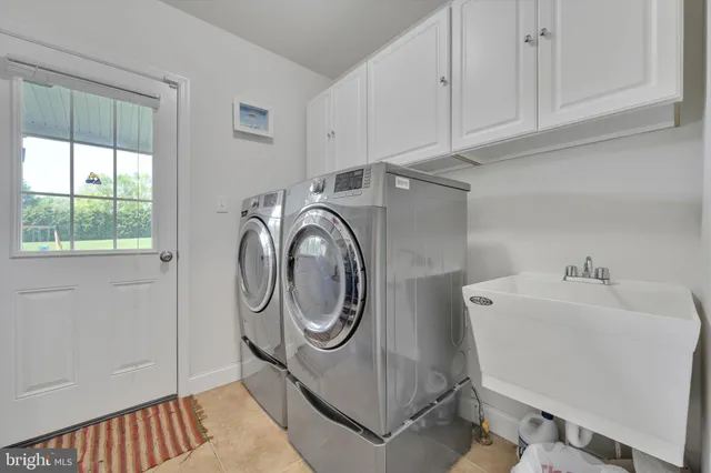a spacious bedroom with a bed and a ceiling fan