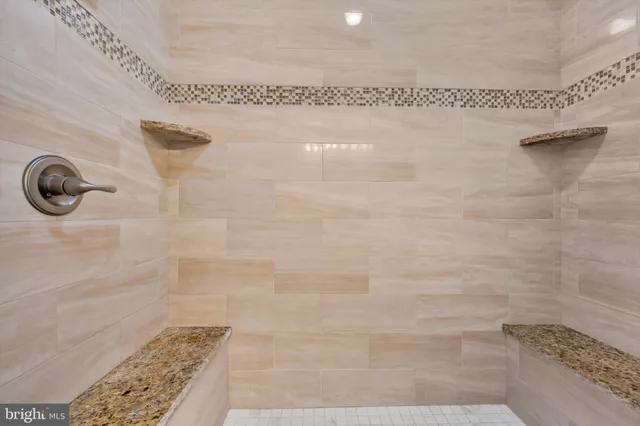 a bedroom with a bed and hallway