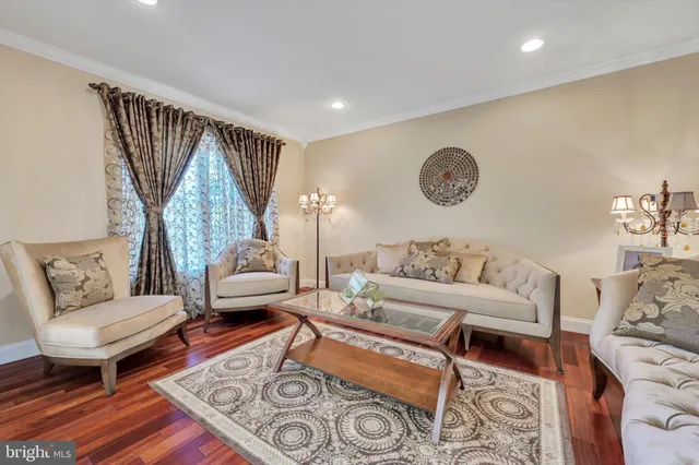 a living room with furniture and stairs