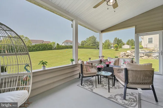 an aerial view of a house with a yard swimming pool outdoor seating and yard