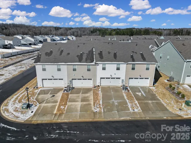 an aerial view of a house with a ocean view