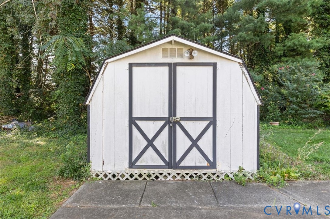 4319 Stately Oak Road North Chesterfield, VA 23234 - Photo 51 of 51 White storage shed with gambrel roof and double do