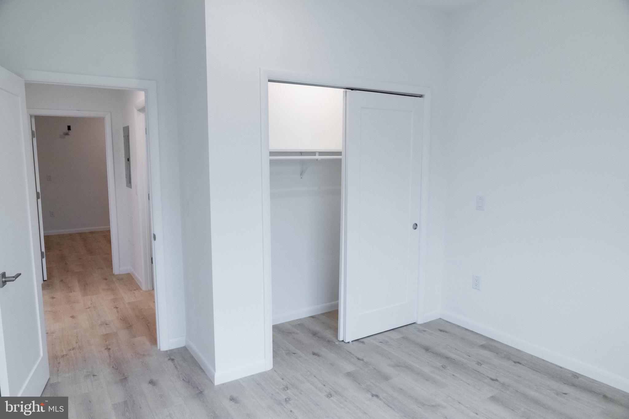 7248 Rising Sun Avenue, Unit 201 Philadelphia, PA 19111 - Photo 11 of 20 an empty room with wooden floor and closet